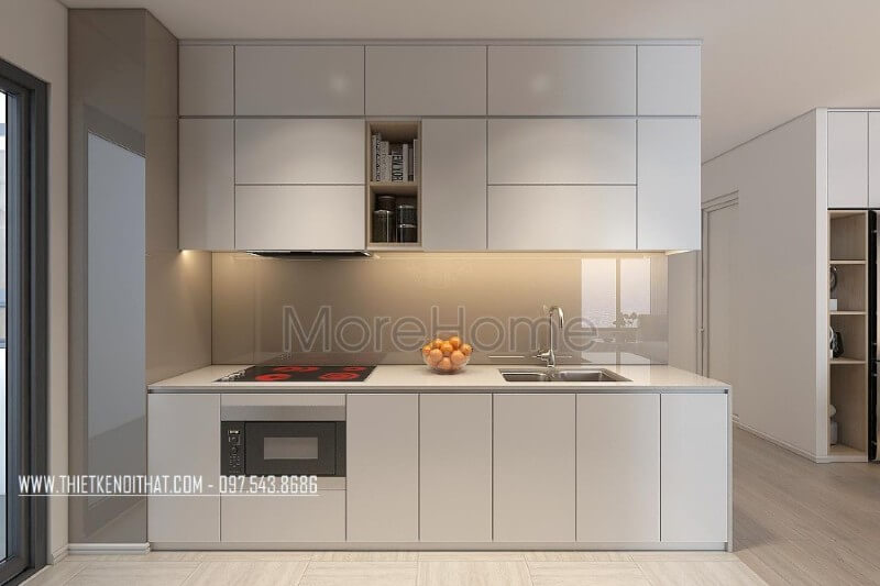 Mẫu tủ bếp kiểu dáng chữ i gỗ acrylic màu trắng kết hợp phân chia các ngăn tủ một cách hợp lí, tạo cho người nội trợ thuận tiện hơn trong quá trình mang lại những bữa cơm ngon miệng cho những người thân yêu của mình Tủ bếp hiện đại